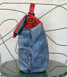 GOLDxTEAL stylish handmade denim and red leather handbag.
