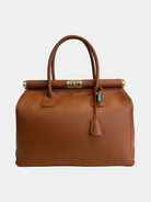 GOLDxTEAL gorgeous amber leather color handbag with gold metal lock.