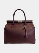 GOLD xTEAL chic Bordeaux leather lock handbag.