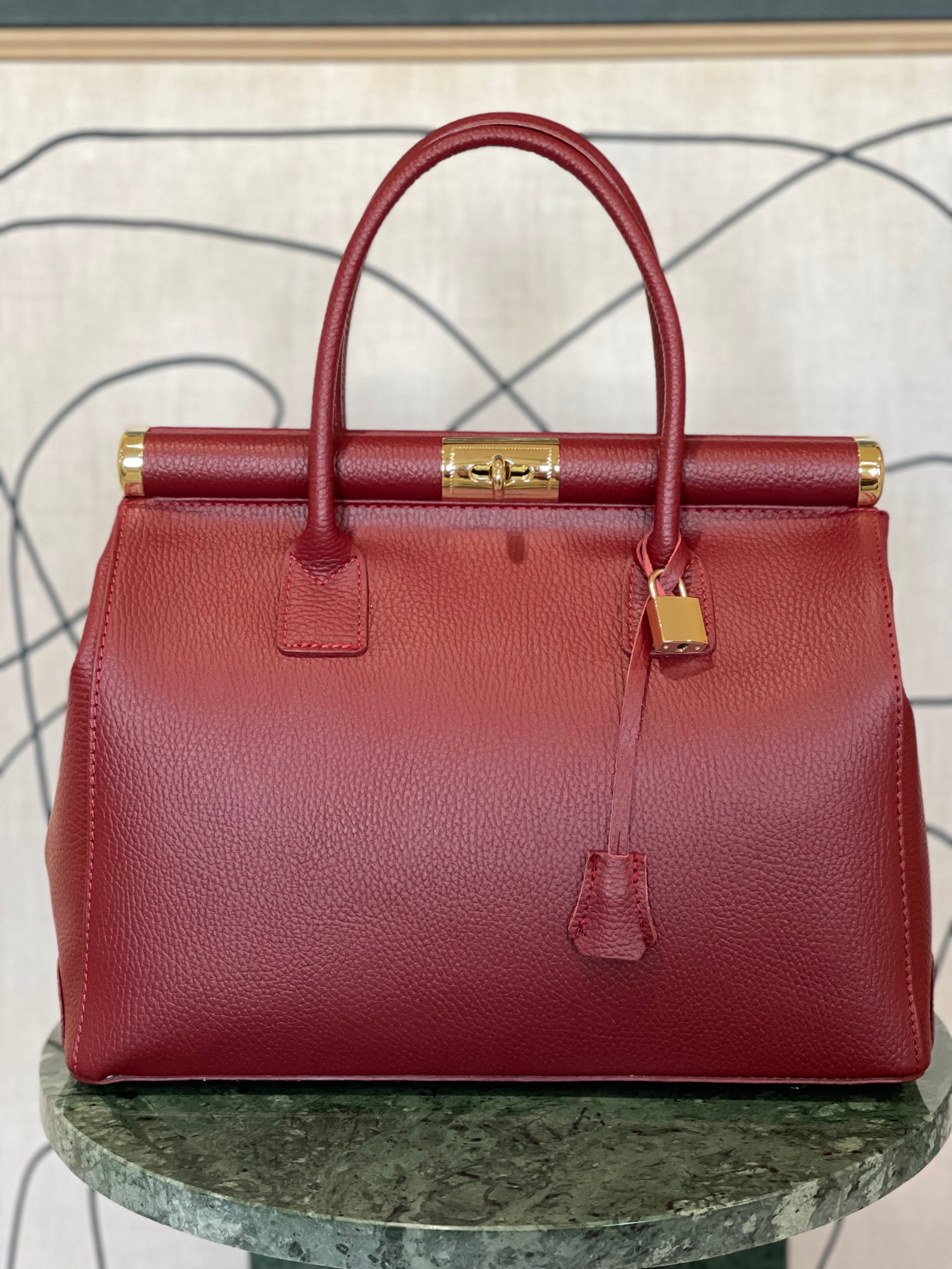 GOLD xTEAL chic Bordeaux leather lock handbag.