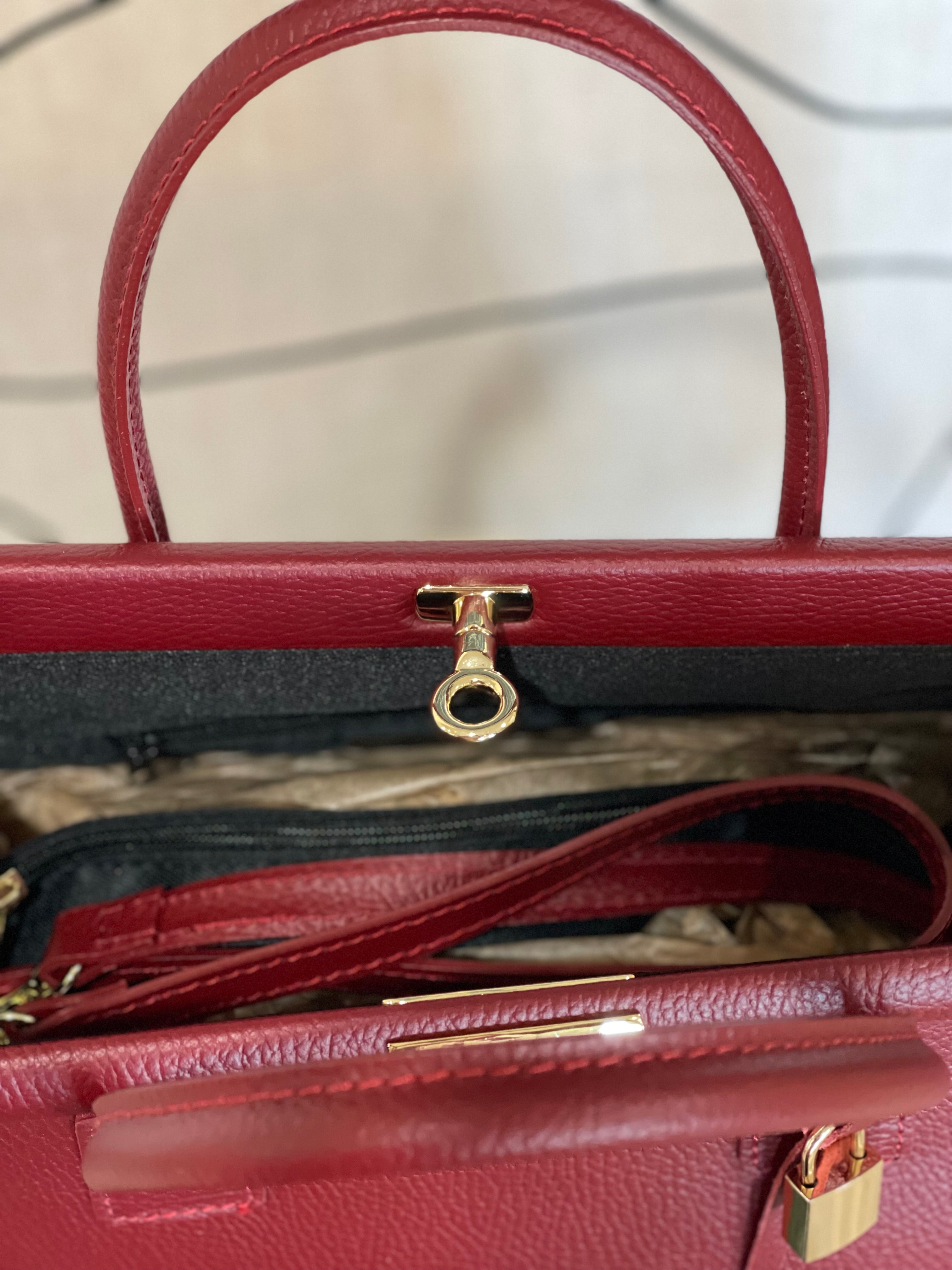 GOLD xTEAL chic Bordeaux leather lock handbag.