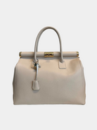 GOLDxTEAL gorgeous ecru leather handbag with gold lock detail.