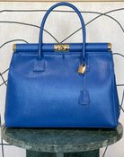 GOLDxTEAL gorgeous blue electric leather handbag with gold tone metal lock.