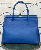 GOLDxTEAL gorgeous blue electric leather handbag with gold tone metal lock.