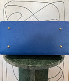 GOLDxTEAL gorgeous blue electric leather handbag with gold tone metal lock.