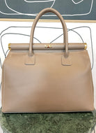 GOLDxTEAL gorgeous taupe leather handbag with gold tone lock.