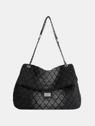 GOLDxTEAL quilted charcoal denim handbag.