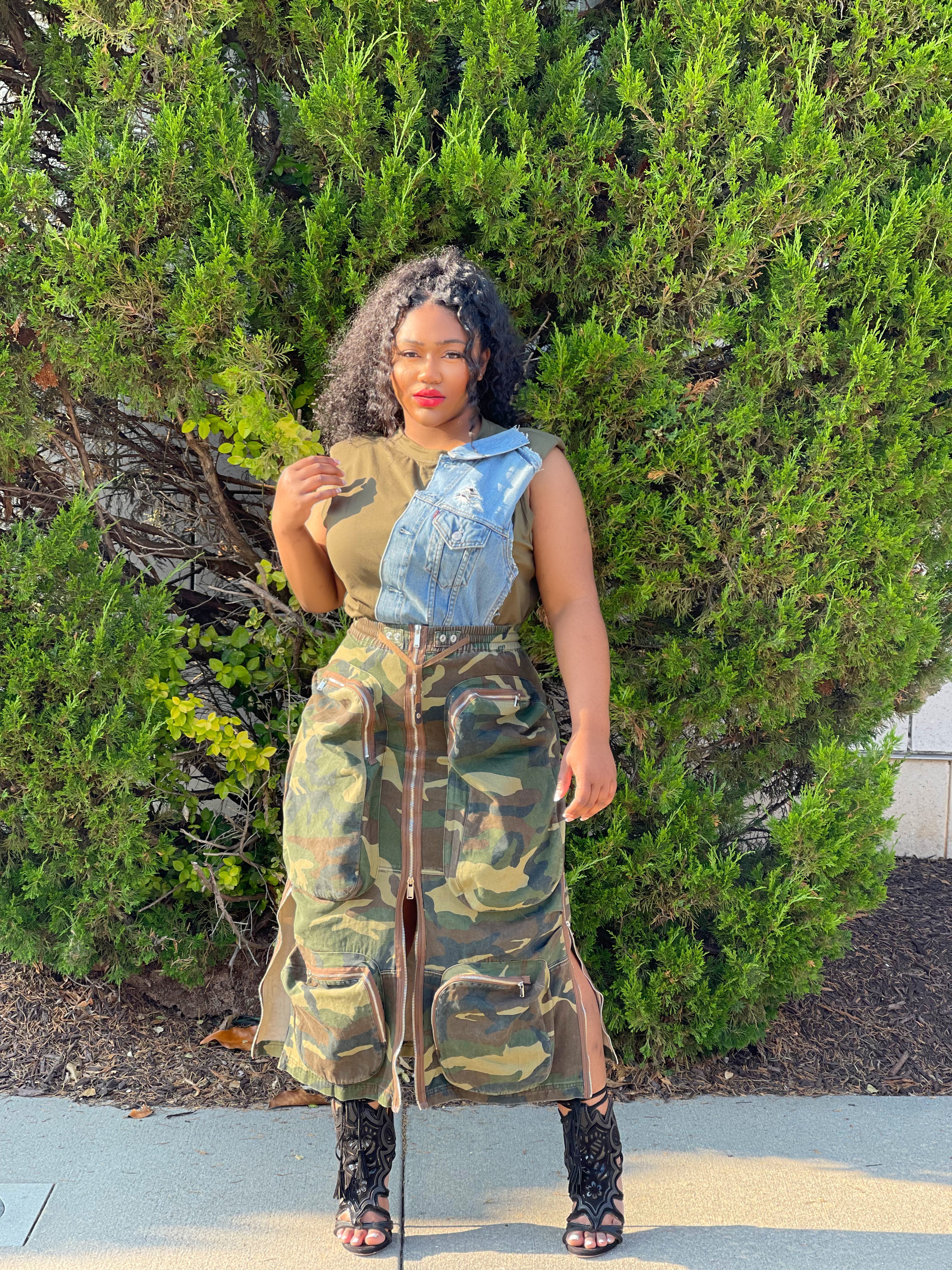 GOLDxTEAL camouflage pocket midi skirt. Stylish camouflage print skirt accented with oversized pockets.