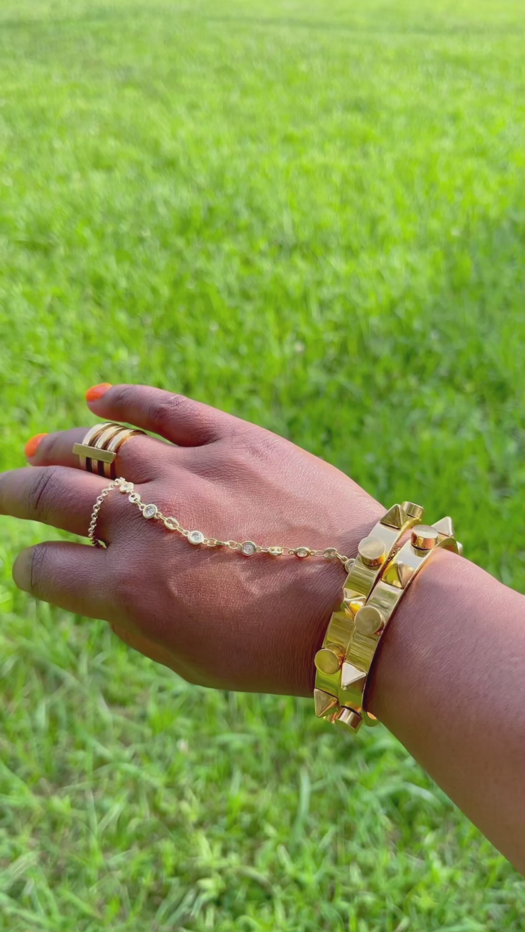 PORTIA ALEXANDER designer gold hand chain.