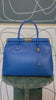 GOLDxTEAL gorgeous blue electric leather handbag with gold tone metal lock.