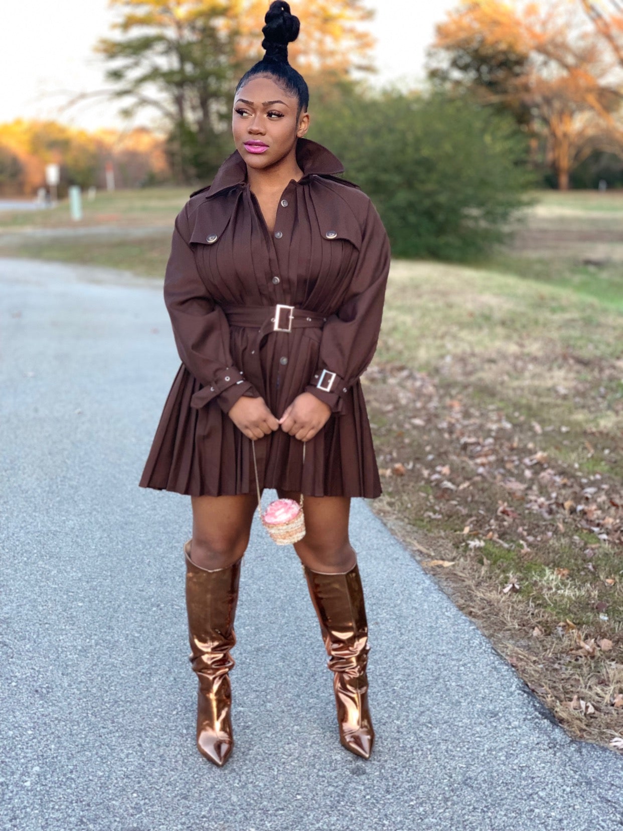 GOLDxTEAL Mousse Pleated Trench Coat. Gorgeous deep brown colored trench coat with a modern pleated body, waist belt and front button closure.