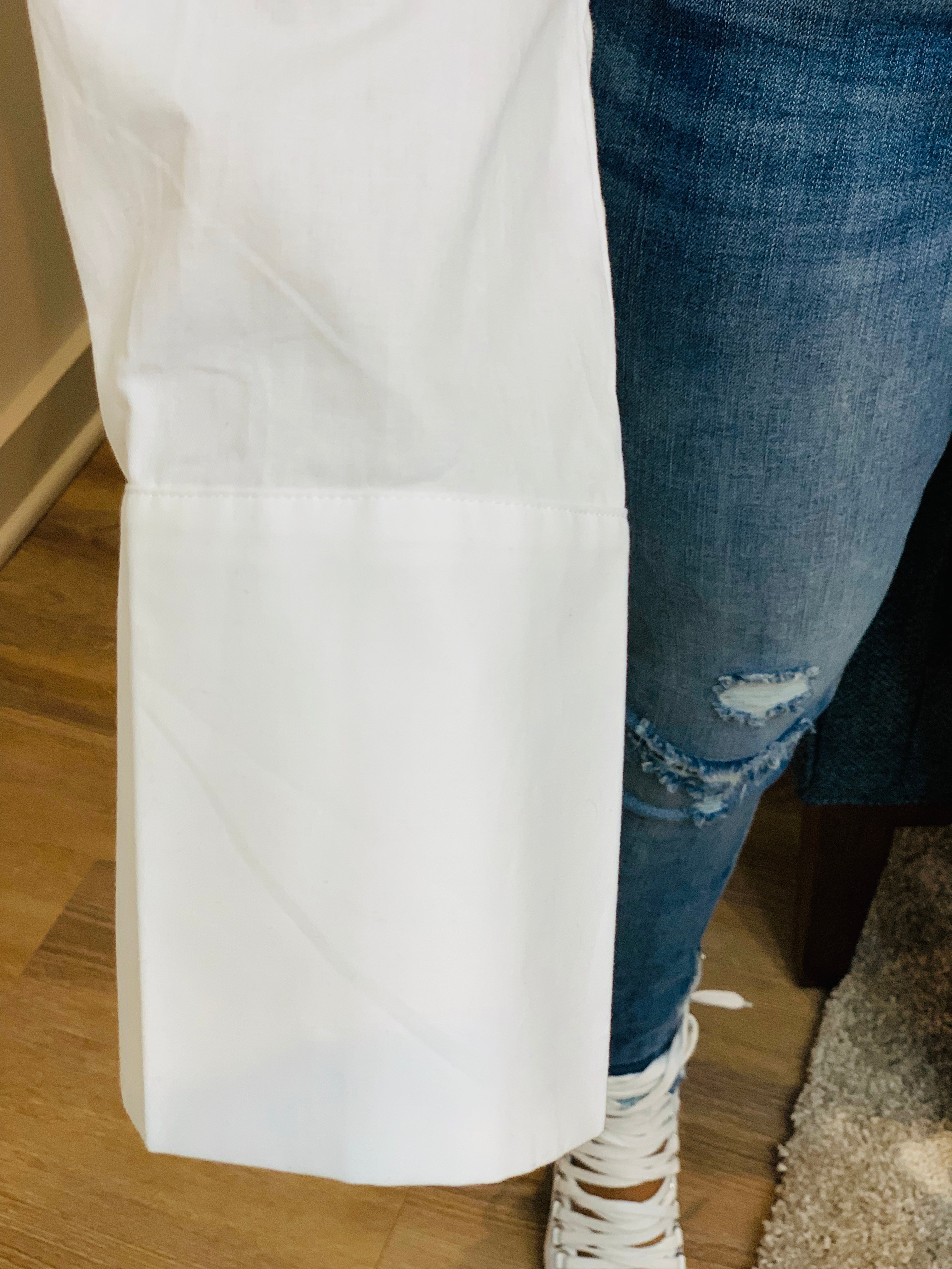 GOLDxTEAL stylish cropped white button up shirt. Modern asymmetrical button up shirt with  a raw hem line.