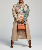 GOLDxTEAL Tatsu Trench Coat. Gorgeous colorful printed paneled blazer trench coat accented with side zippers.