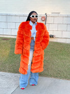 GOLDxTEAL orange faux fur coat.