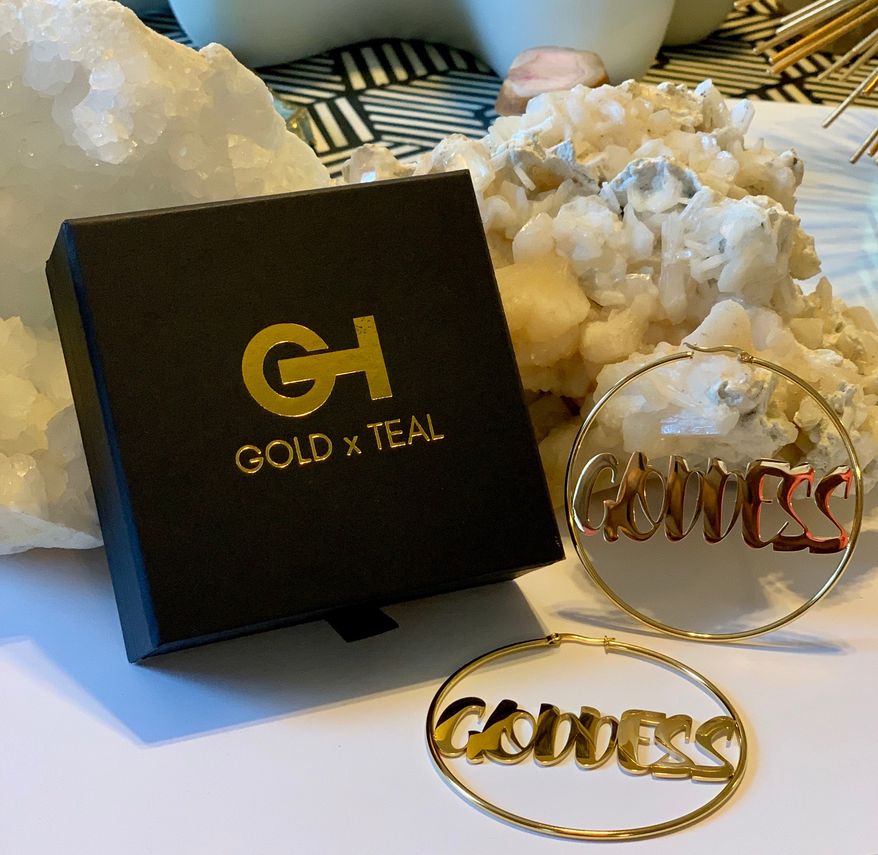 GOLDxTEAL Goddess Gold Hoop Earrings. Stylish gold plated goddess name plate hoop earrings.