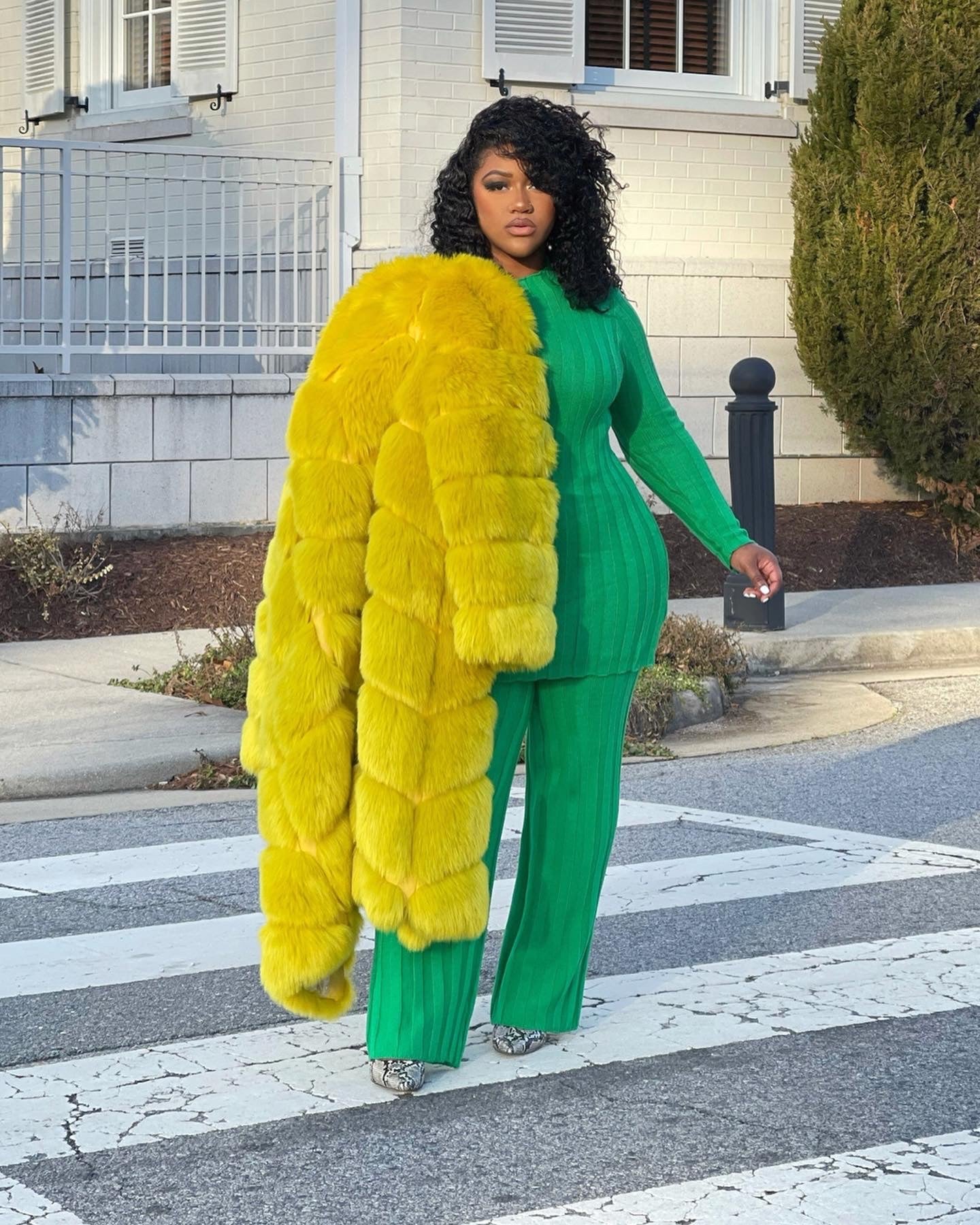 GOLDxTEAL yellow faux fur coat.