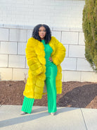 GOLDxTEAL yellow faux fur coat.