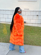 GOLDxTEAL orange faux fur coat.