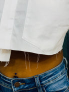 GOLDxTEAL stylish cropped white button up shirt. Modern asymmetrical button up shirt with  a raw hem line.