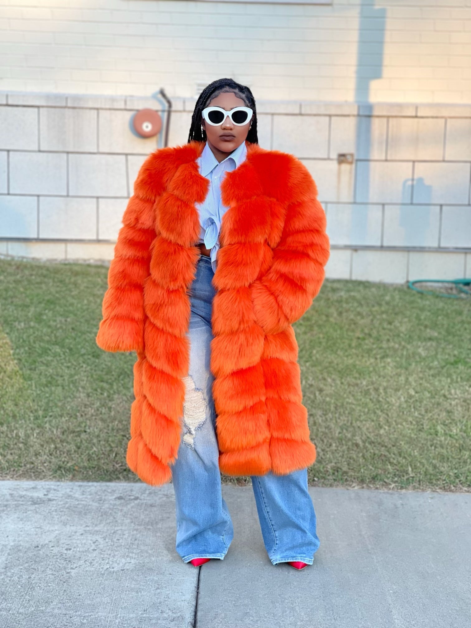 GOLDxTEAL orange faux fur coat.