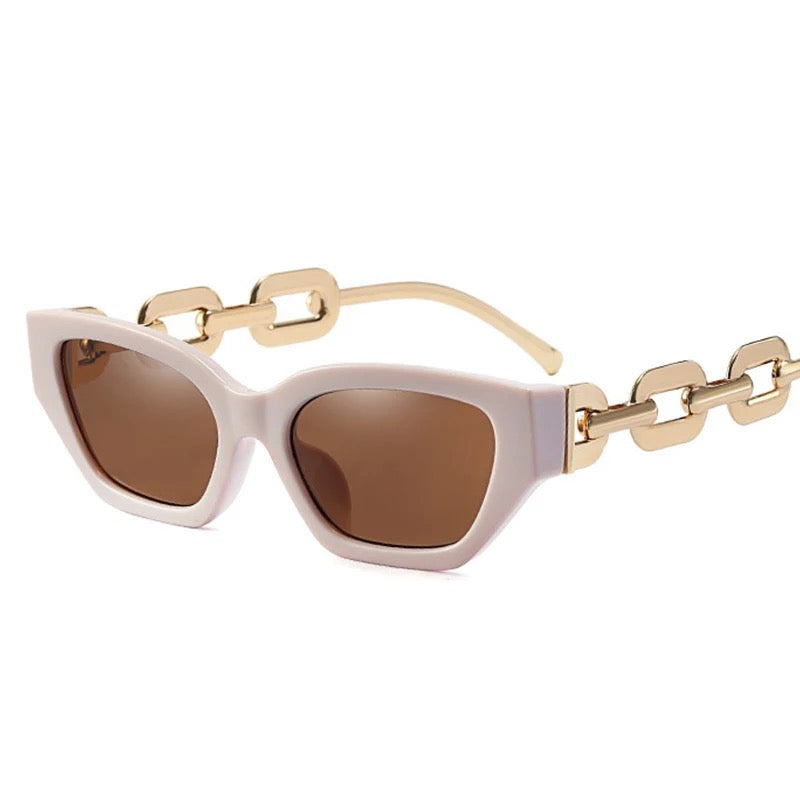 GOLDxTEAL blush cat eye sunglasses with metal chain arms.