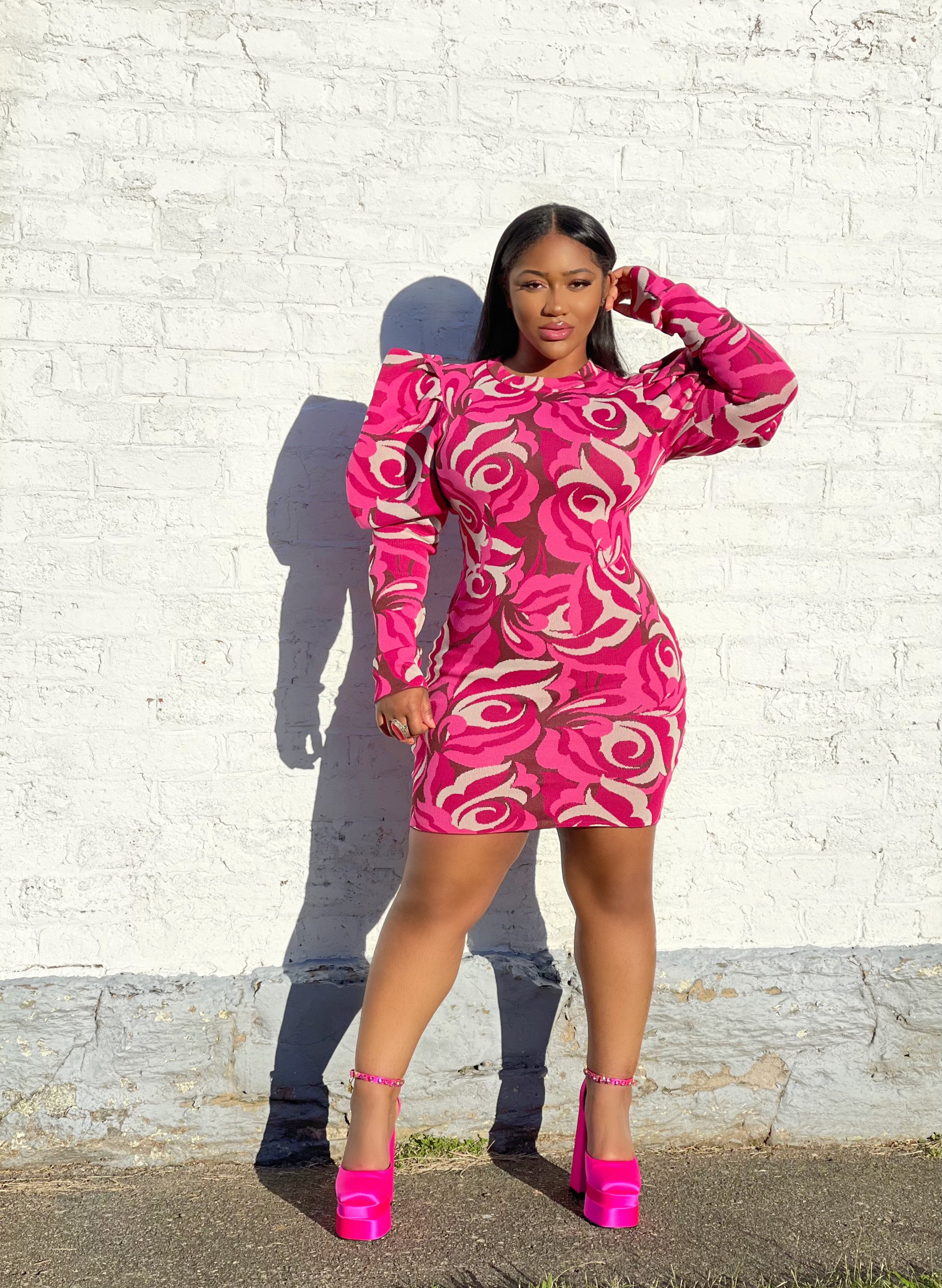 GOLDxTEAL pink printed knitted mini dress. Stylish knit mini dress with exaggerated puff sleeves.